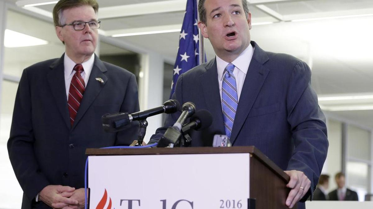 Texas Lt. Gov. Dan Patrick. left, looks on as former presidential candidate Ted Cruz speaks at a press conference Oct. 26 in Houston.