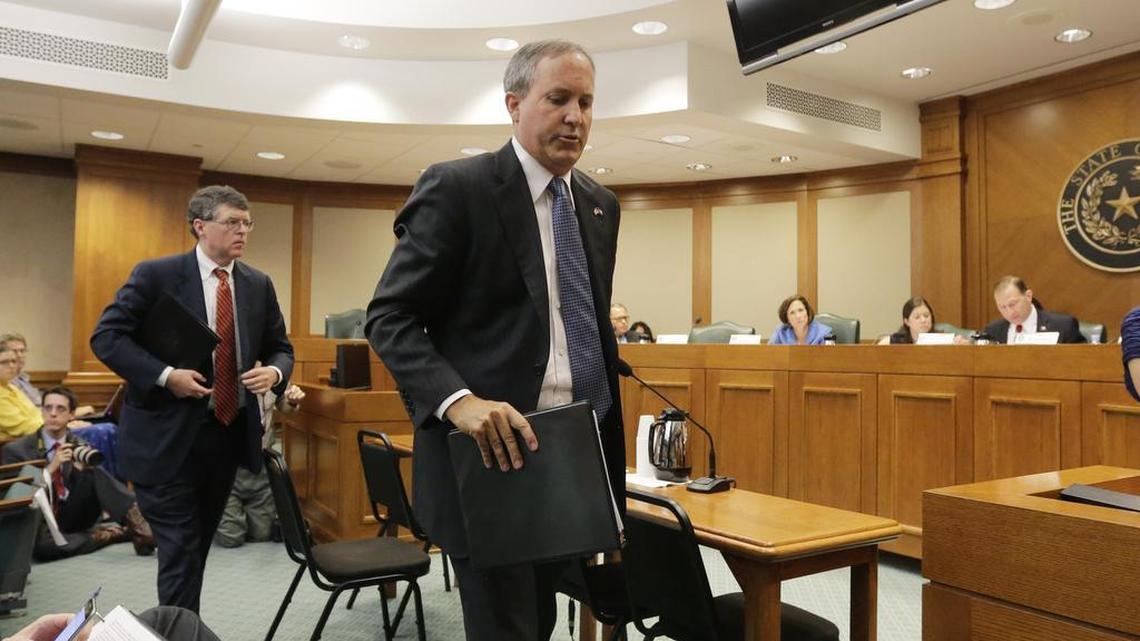 
Texas attorney general Ken Paxton, right, with his chief of staff Bernie McNamee, departs after he testified during a Texas Texas Senate Health and Human Services Committee hearing on Planned Parenthood videos last week. 
