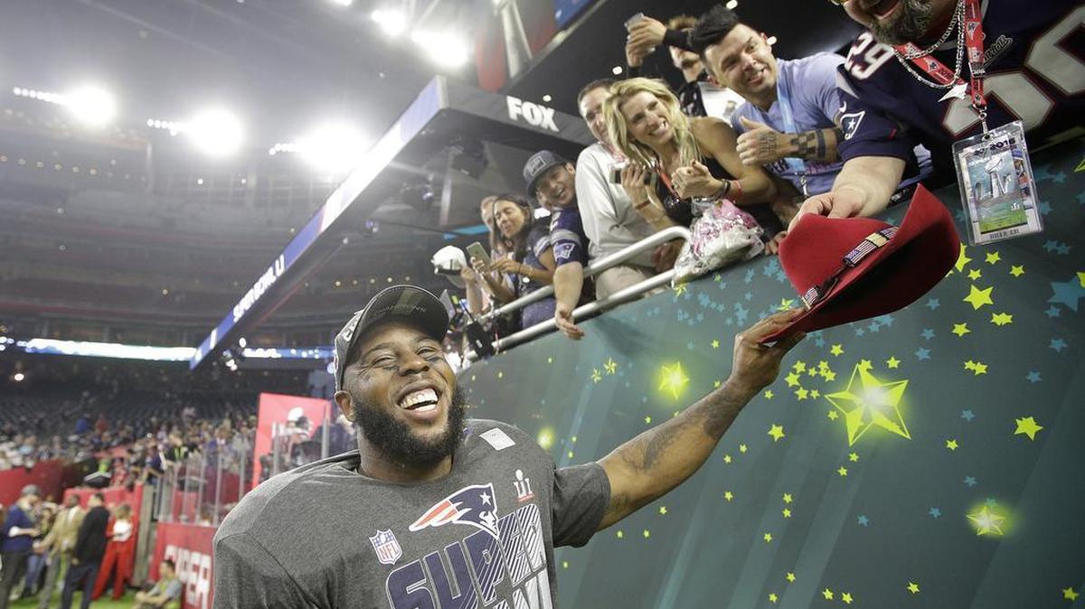 A New England Patriots player celebrates with fans after Super Bowl 51 in Houston. An NFL spokesman on Friday said "discriminatory" proposals signed into law would be taken into consideration in awarding future events.