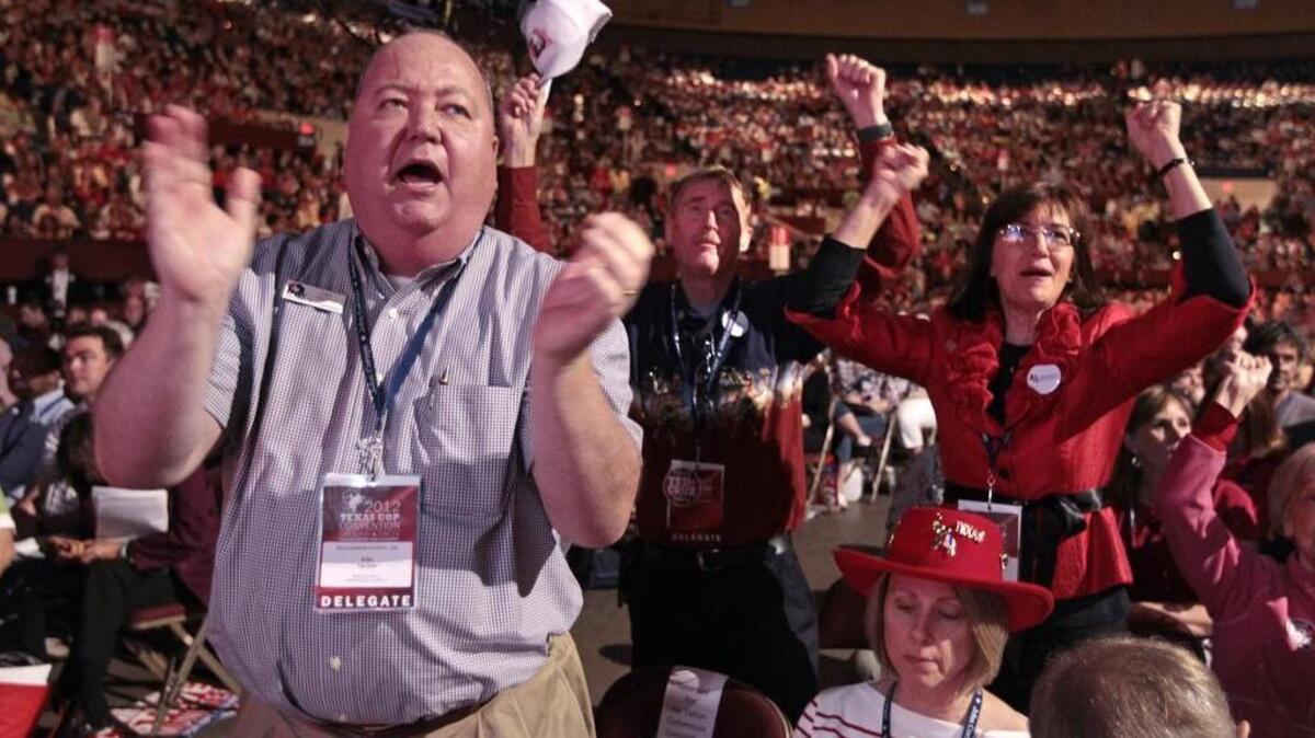 Williamson County delegate Hal Talton, left, was joined by others as they cheered for U. S. Senator Kay Bailey Hutchison at the state Republican convention in the FWCC on Friday June 8, 2012.