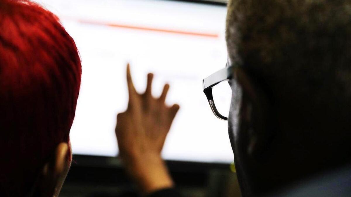 FILE: In this Thursday, March 3, 2016, file photo, people work on a job search on a computer at an office in Atlanta. On Saturday, Oct. 1, 2016, the U.S. government plans to cede control of some of the internet’s core systems, namely, the directories that help web browsers and apps know where to find the latest weather, maps and Facebook musings. Texas is among several states suing to stop the transfer. (AP Photo/David Goldman, File)