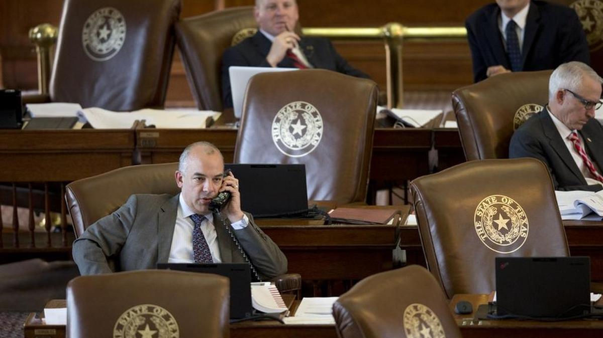 State Rep. Chris Turner, left, on the House floor during a budget debate on March 31, 2015.