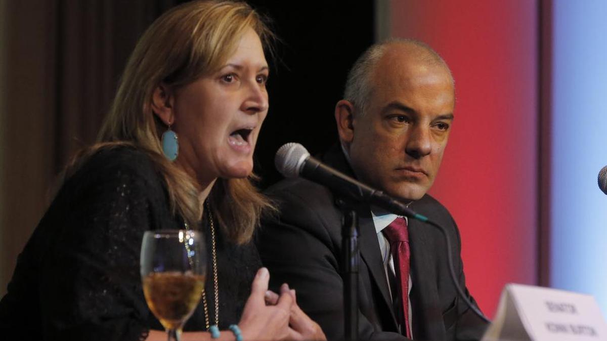 State Senator Konni Burton, of Colleyville, shown here with State Rep. Chris Turner of Arlington during a Fort Worth event last year, says Joe Barton should step down.
