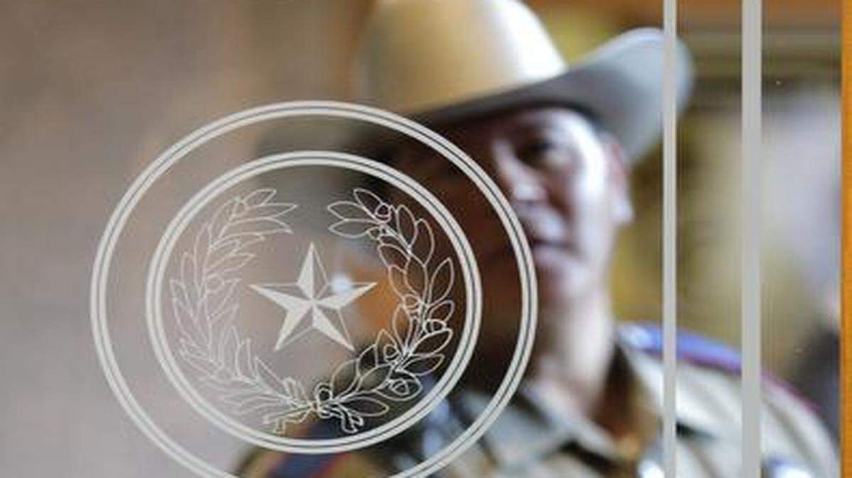 
A Texas state trooper stands outside of a hearing where lawmakers discuss whether to legalize concealed handguns on college campuses and open carry everywhere else, Thursday, Feb. 12, 2015, in Austin, Texas.
