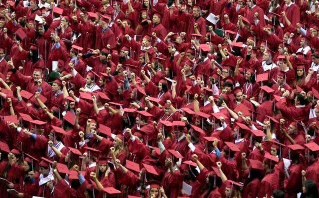
Northwest High School seniors sing the alma mater at graduation in June 2014.
