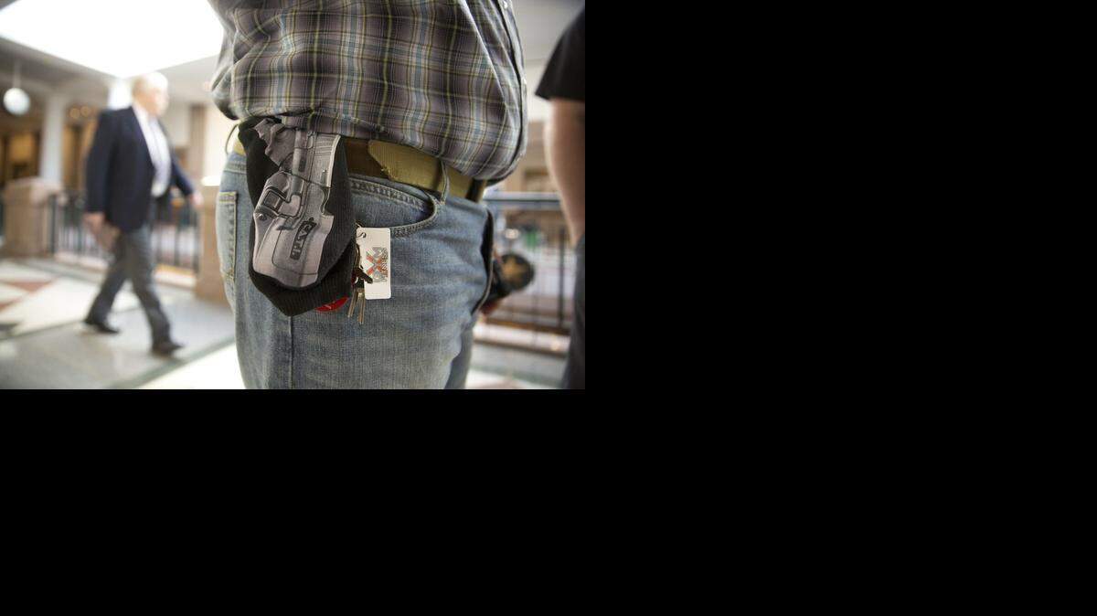 
Jason Orsek with Come and Take it America wears a cloth gun holder with a photo of a gun imprinted on it at the Texas Capitol on Feb. 12, 2015, when the Senate Committee on State Affairs heard testimony on gun-related bills.
