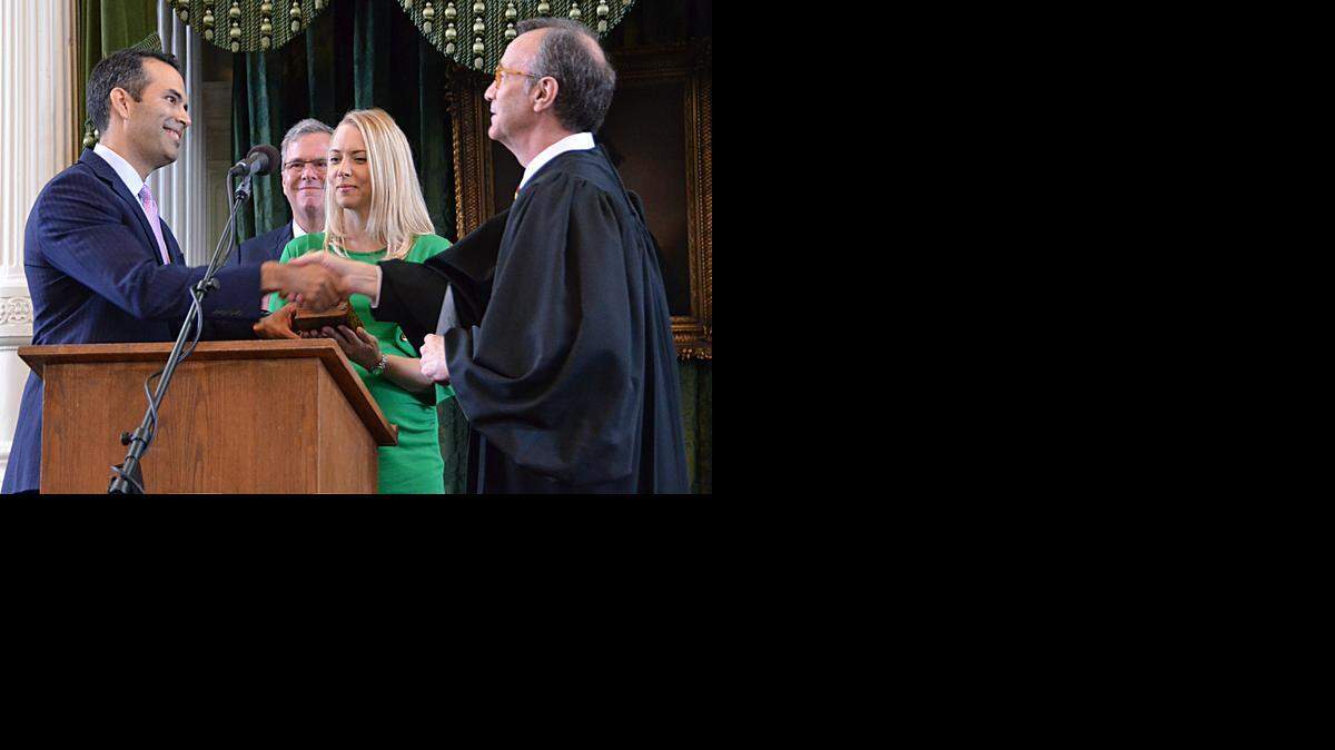 
George P. Bush was sworn in as the 28th Texas land commissioner by federal Judge Sidney A. Fitzwater.
 
