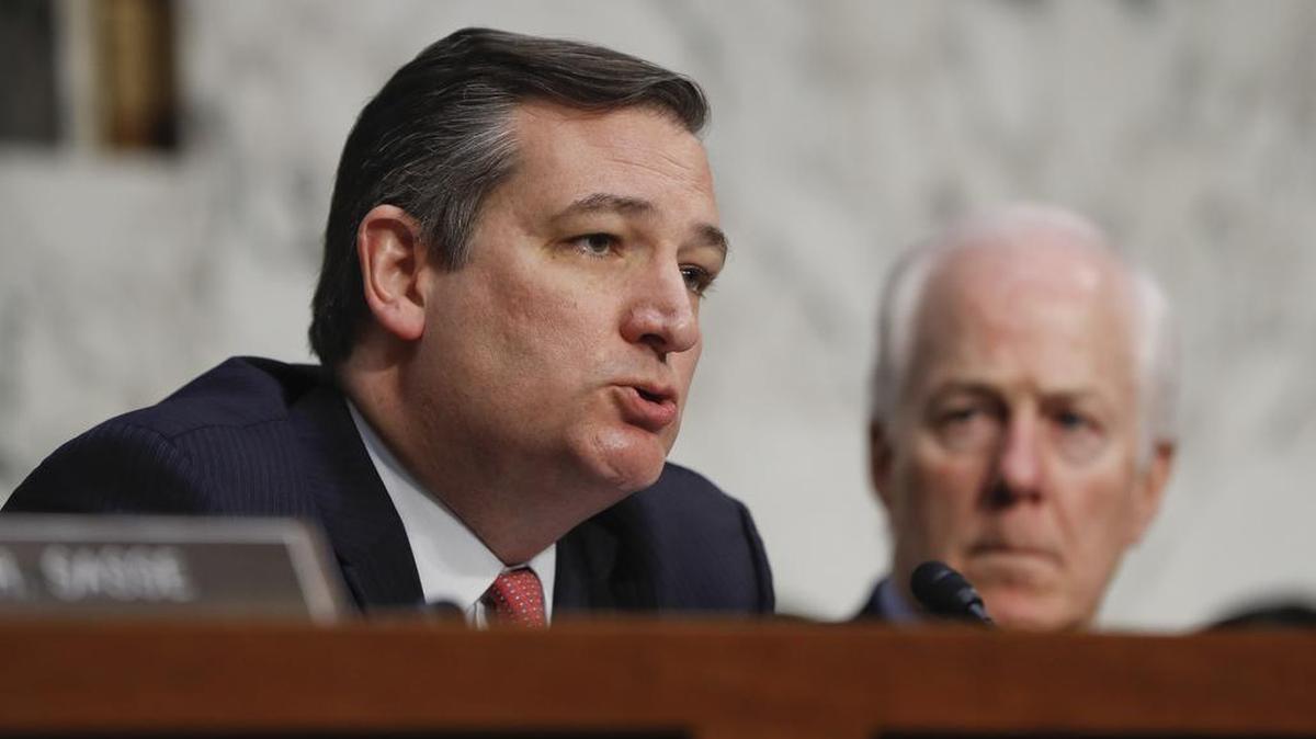 FILE - Sen. Ted Cruz, R-Texas, left, questions former Acting Attorney General Sally Yates and former National Intelligence Director James Clapper as Sen. John Cornyn, R-Texas, right, looks on during during Yates and Clappers testified on Capitol Hill in Washington, Monday, May 8, 2017, before the Senate Judiciary subcommittee on Crime and Terrorism hearing: "Russian Interference in the 2016 United States Election."