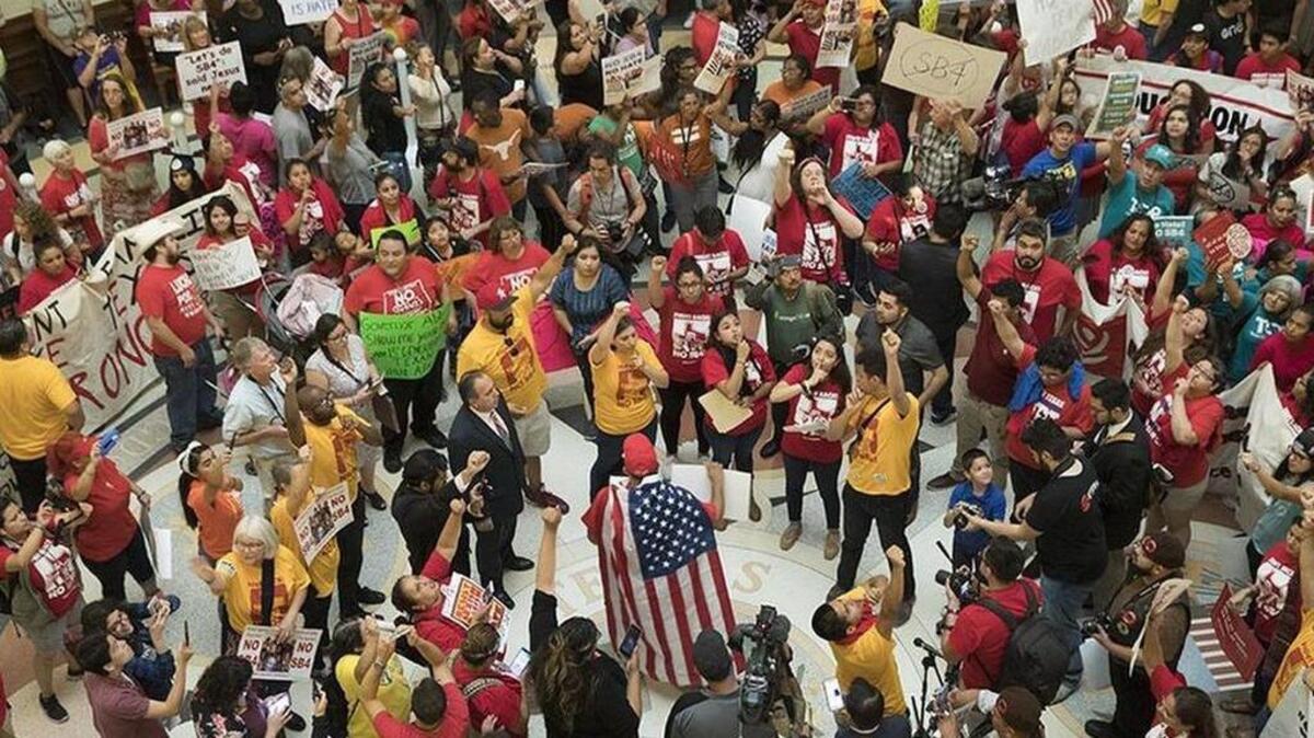 Massive protest engulfs the Texas Capitol rotunda as anti-SB4 protesters rally on May 29, the last day of the 85th legislative session.