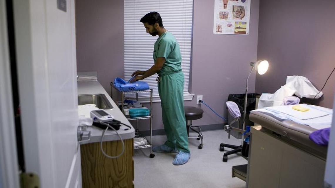 Dr. Bhavik Kumar prepared a procedure room for a patient at Whole Woman’s Health clinic in Fort Worth, on Feb. 20, 2016.