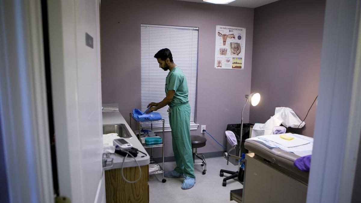 Dr. Bhavik Kumar prepares a procedure room for a patient at Whole Woman's Health clinic Feb. 20 in Fort Worth.