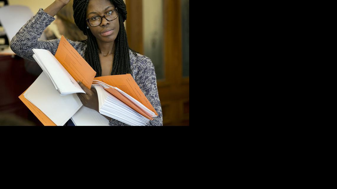 
Cambrey Dent, a legislative aide for Texas Sen. Judith Zaffirini, lines up in the Senate secretary’s office to file bills, Friday, March 13, 2015, in Austin. (AP Photo/Austin American-Statesman, Ralph Barrera)
