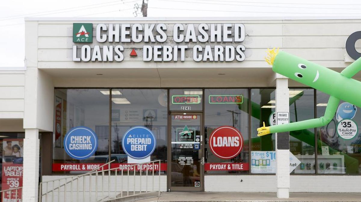 A loan store is photographed on South Cooper Street in Arlington in 2015. Antpoverty advocates are warning that a pair of proposals in the Legislature could perpetuate a cycle of debt for millions of Texans.