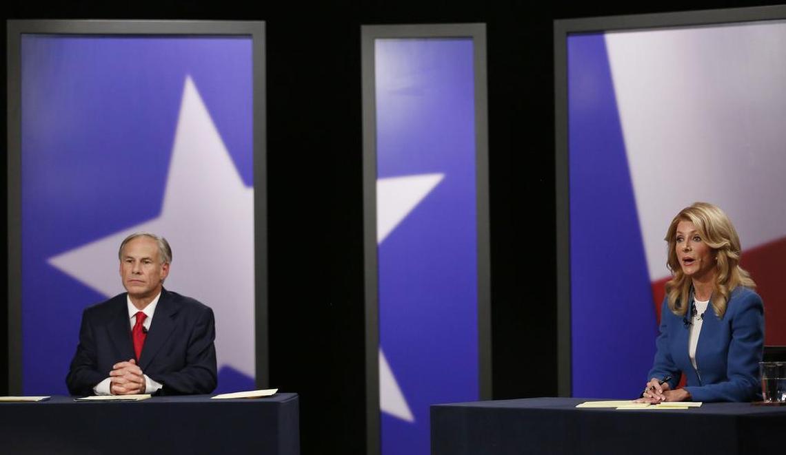 Texas State Senator Wendy Davis (right), Democratic candidate, and Texas Attorney General Greg Abbott (left), Republican candidate, during the final gubernatorial debate in a KERA-TV studio in Dallas Tuesday September 30, 2014.