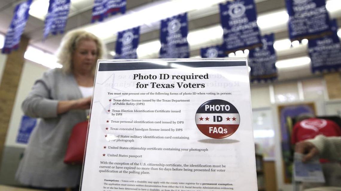 A sign tells voters of voter ID requirements before a primary election in Arlington. Federal judges on Friday ruled that three Congressional districts were improperly gerrymandered in the latest case involving Texas voting rights.