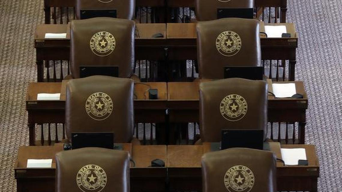 State Rep. Drew Springer, R-Gainsville, works at his desk as he waits for the House to convene Tuesday in Austin. The House abruptly ended its work for the special session, one day early.