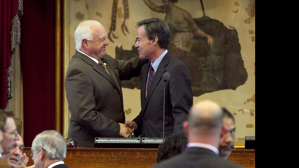 
Former state Rep. and current Texas Agriculture Commissioner Sid Miller, left, and Speaker of the House Joe Straus react at the end of the special session at the Capitol in Austin, Texas, on Wednesday, June 29, 2011. (AP Photo/Austin American-Statesman, Deborah Cannon) MAGS OUT; NO SALES; TV OUT; INTERNET OUT; AP MEMBERS ONLY; MANDATORY CREDIT ORG XMIT: TXAUS105
