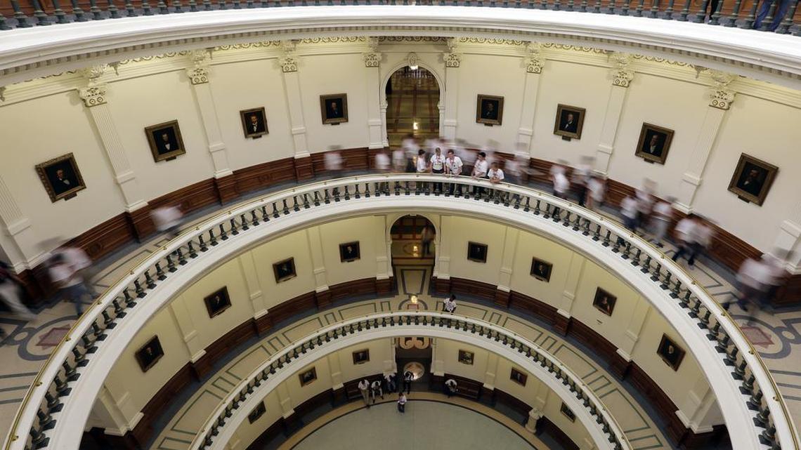 Visitors move though the rotunda at the Texas Capitol on June 15 in Austin.
