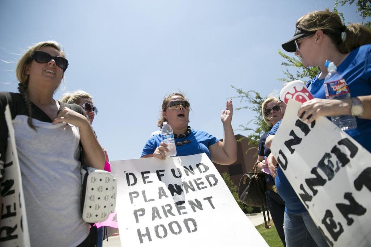 Protesters outside Planned Parenthood in Fort Worth in 2015 called for the defunding of the organization. Some anti-abortion advocates in Texas favor bringing criminal charges against abortion patients.