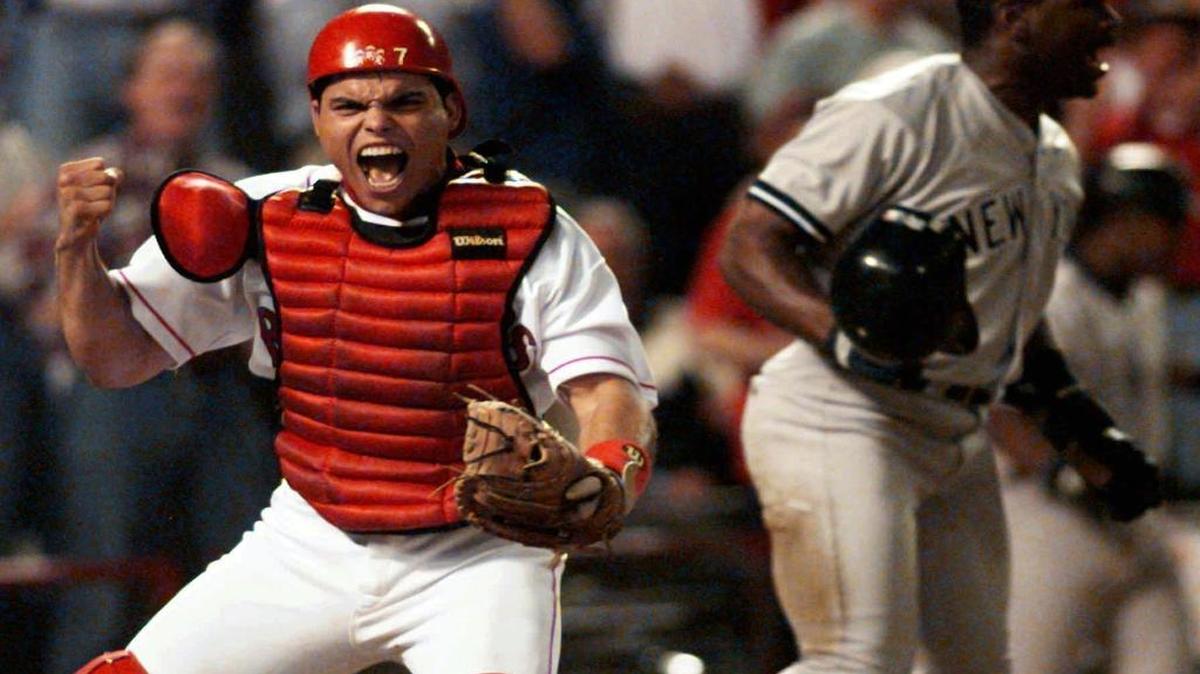 Texas Rangers catcher Ivan “Pudge” Rodriguez reacts after tagging out the New York Yankees’ Tim Raines during Game 3 of the American League divisional playoffs Oct. 4, 1996, in Arlington.