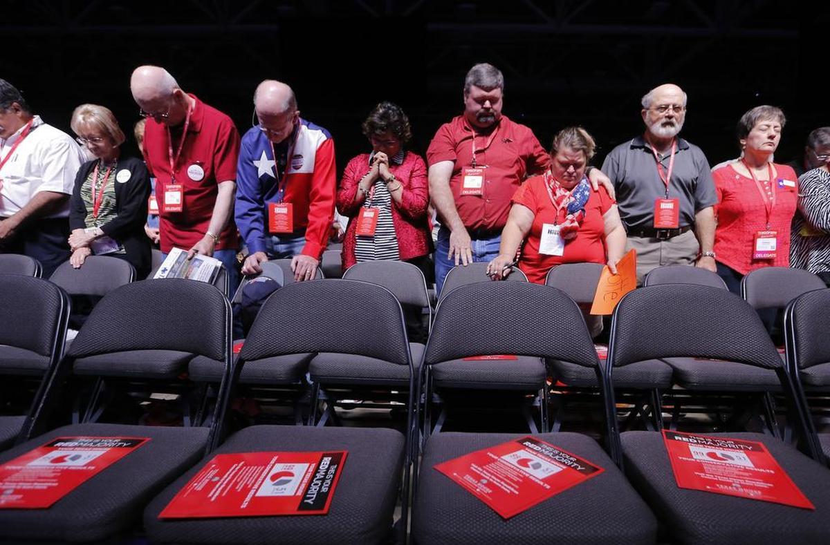 Delegates pray before the state Republican convention in Dallas in 2016.