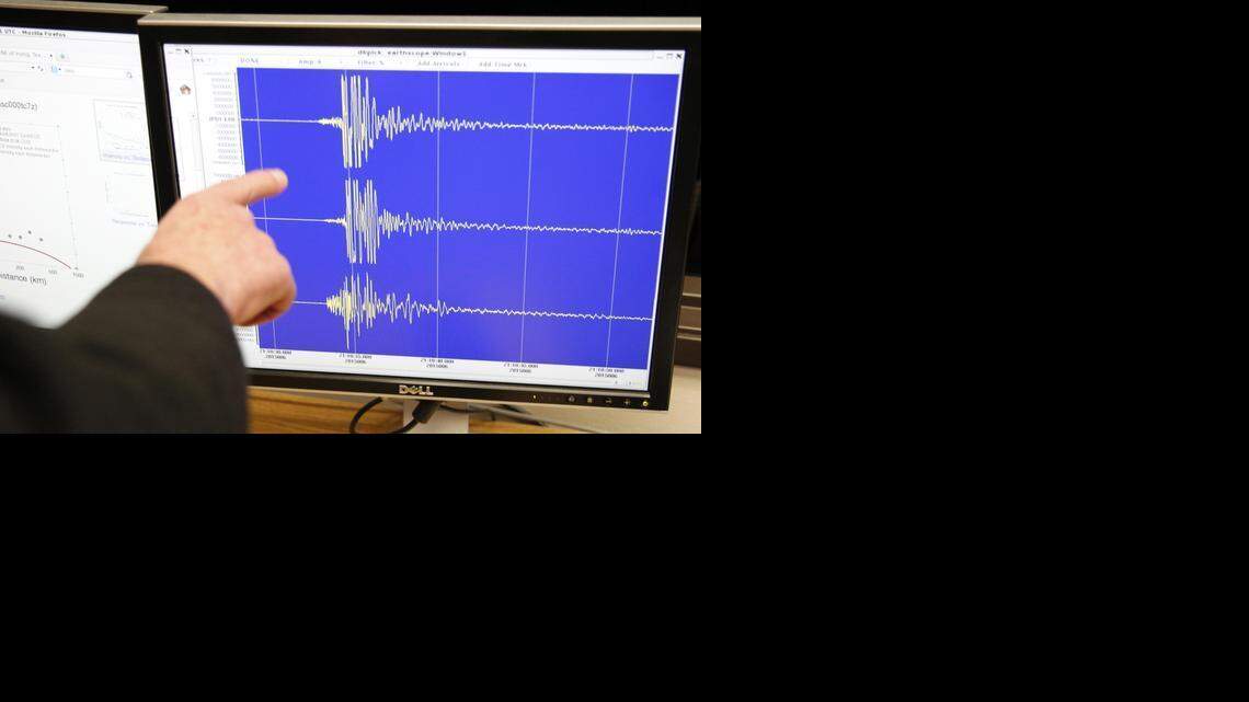 
SMU professor Brian Stump points to seismograms.


