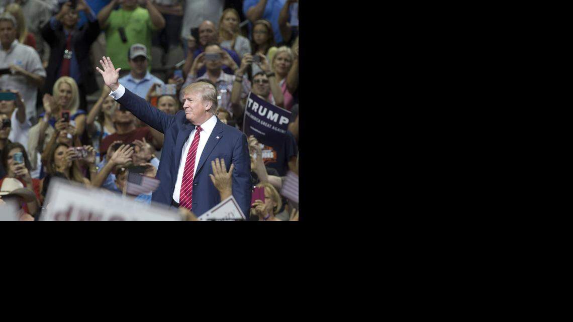 GOP presidential candidate waves to his supporters during a rally at American Airlines Center in Dallas on Monday. 