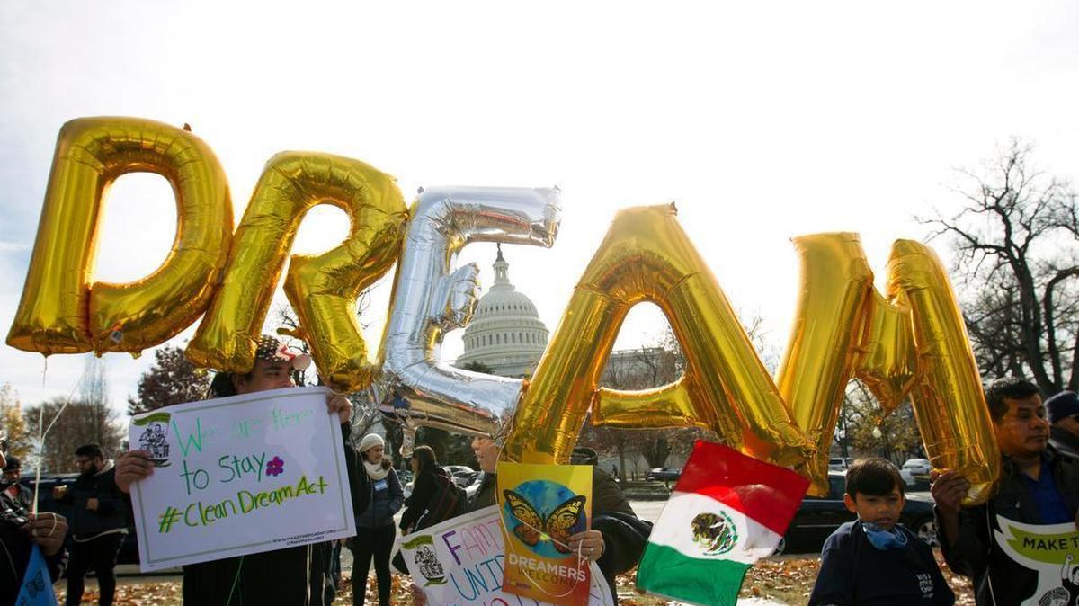 Demonstrators hold up balloons during an immigration rally in support of the Deferred Action for Childhood Arrivals (DACA), and Temporary Protected Status (TPS), programs, near the U.S. Capitol in Washington, Wednesday, Dec. 6, 2017.