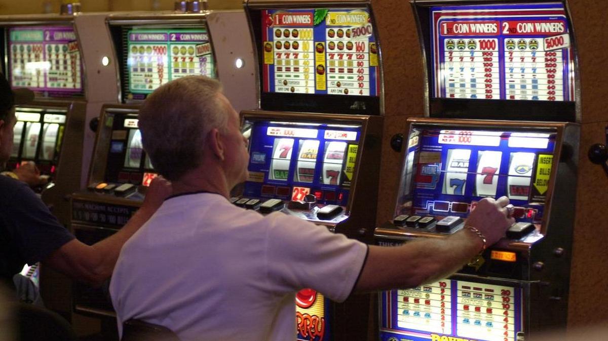 Patrons of the Alabama-Coushatta Entertainment Center casino played slot machines on July 25, 2002, on the Alabama-Coushatta Reservation, east of Livingston, Texas.