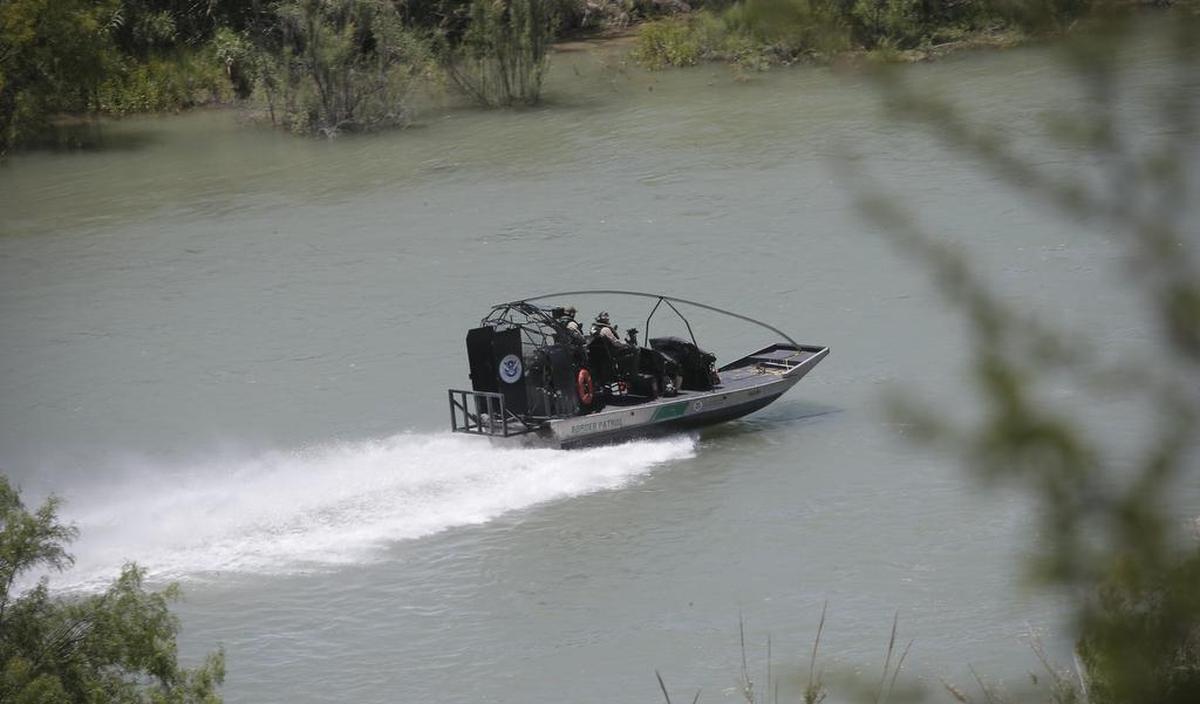 A Border Patrol boat travels along the Rio Grande on April 26 near Quemado.