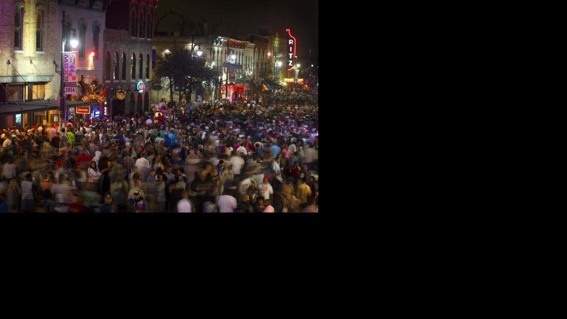  Thousands of people jam Sixth Street in downtown Austin during last year’s SXSW festival.
