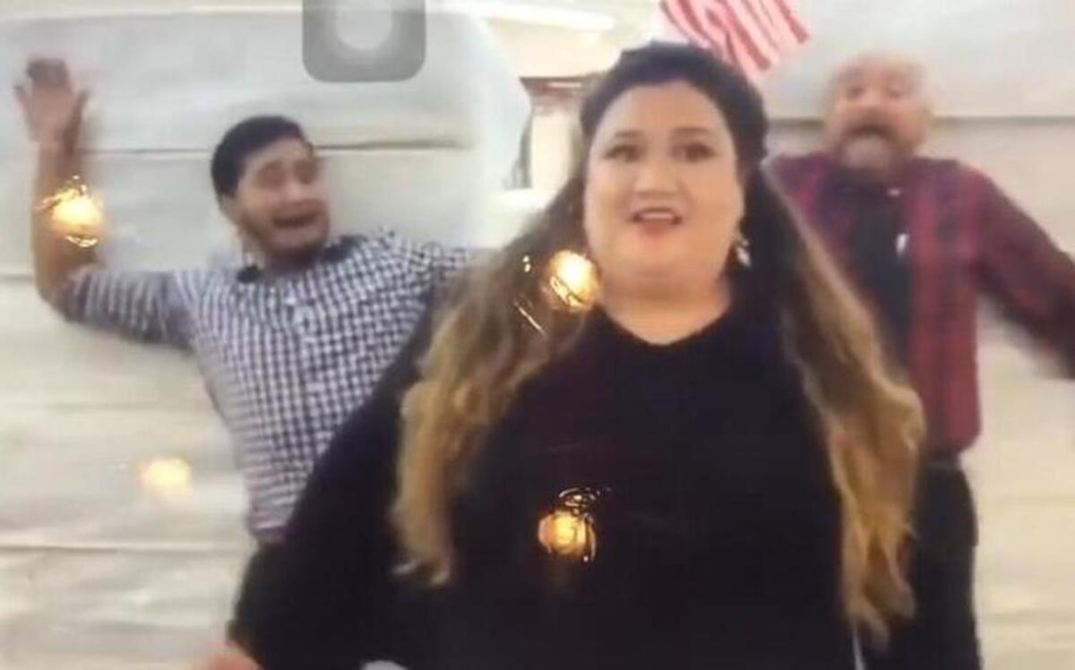 The advertisement for Miracle Mattress showed two employees falling into towers of twin mattresses.