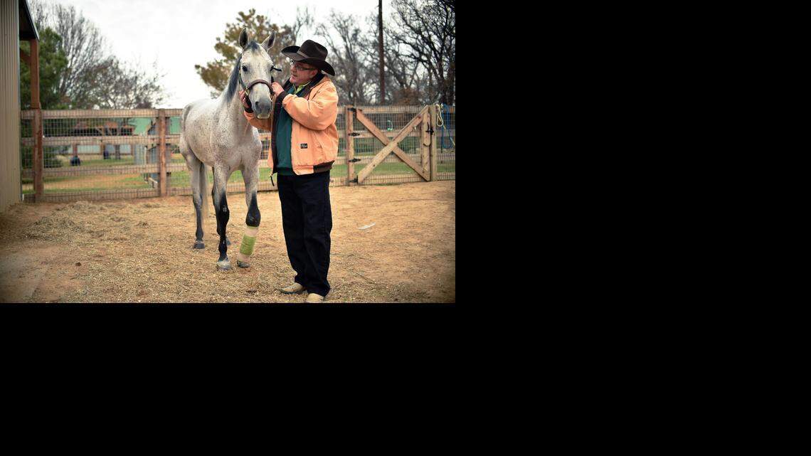 
Ranch Hand Rescue founder Bob Williams in Argyle with Spirit, a horse who was seized from a ranch outside San Antonio in 2012 after being beaten with a baseball bat. Spirit has undergone experimental surgery to help fix a broken leg.
