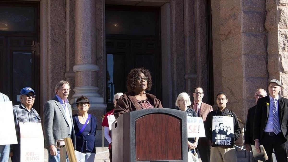 Yolanda White, a board member for the Texas State Employees Union, speaks at a press conference on Jan. 30 in front of the state Capitol.