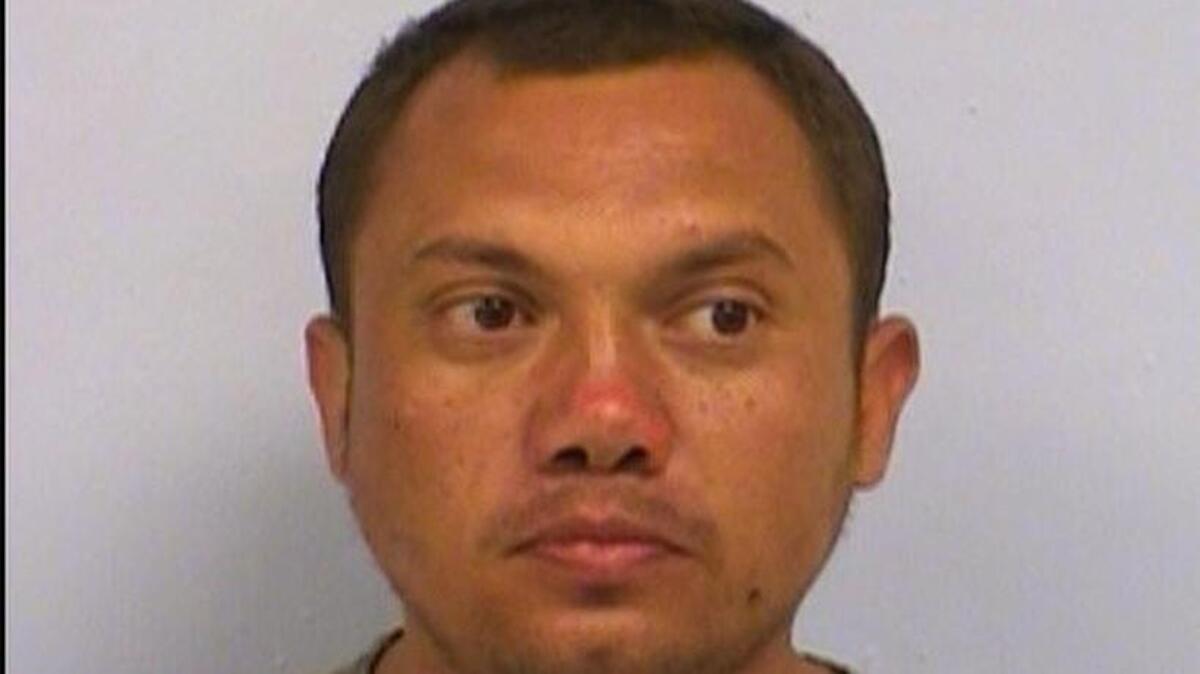 Hubert Justin Powell, 30, is accused of trying to sexually assault an 8-year-old girl in a bathroom stall in a North Austin library on Saturday.