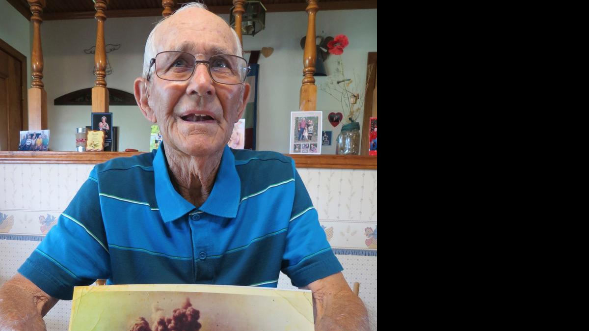 
Louis Ehlinger Sr. of Devine shows a photo of the Nov. 13, 1963, blast at Medina Base in San Antonio. Ehlinger and two other men had only seconds to escape after spotting a fire.


