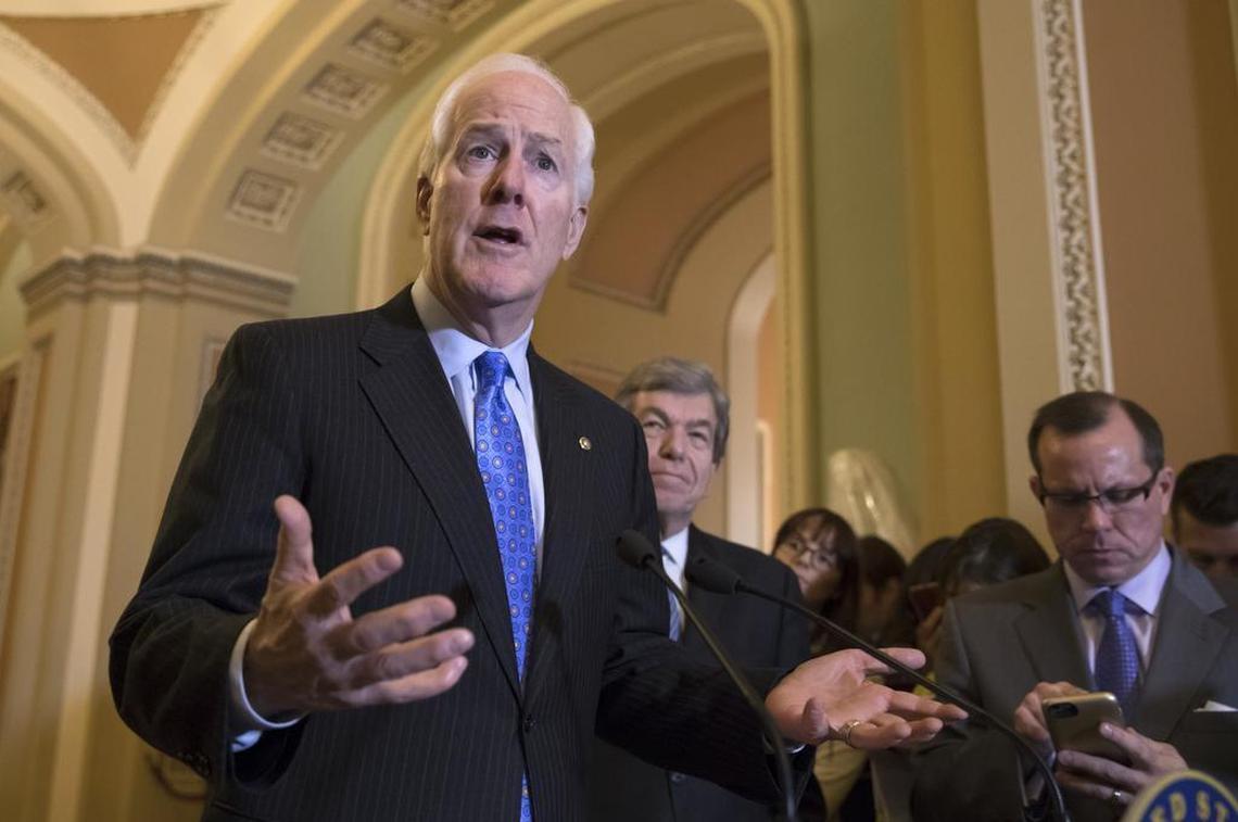 Majority Whip John Cornyn, R-Texas, joined at right by Sen. Roy Blunt, R-Mo., answers a question about the mass shooting at a Texas church this week, during a news conference on Capitol Hill in Washington, Tuesday, Nov. 7, 2017.