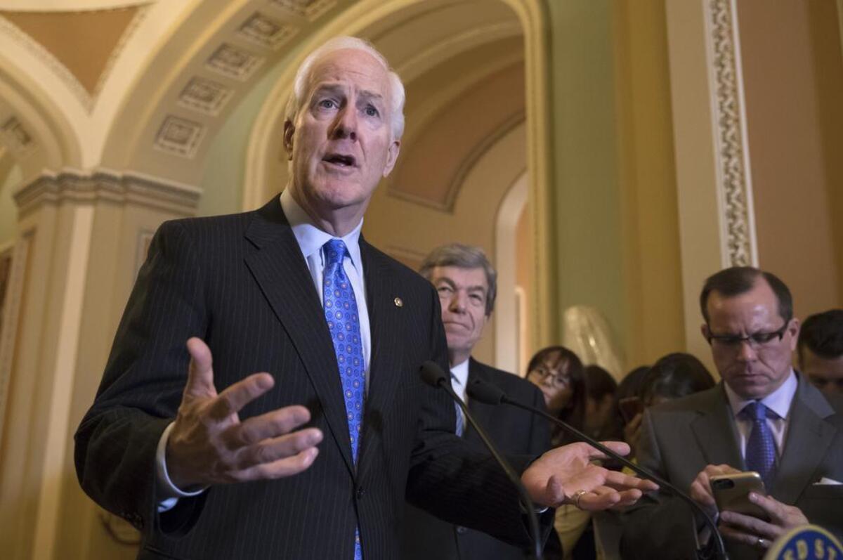 Majority Whip John Cornyn, R-Texas, joined at right by Sen. Roy Blunt, R-Mo., answers a question about the mass shooting at a Texas church this week, during a news conference on Capitol Hill in Washington, Tuesday, Nov. 7, 2017.