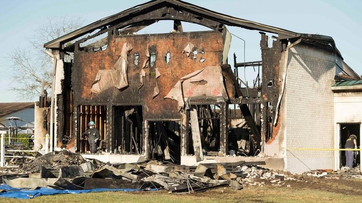 The FBI, ATF and other agencies sift through the burned remains of the Victoria Islamic Center a mosque in Victoria on Jan. 29 2017.