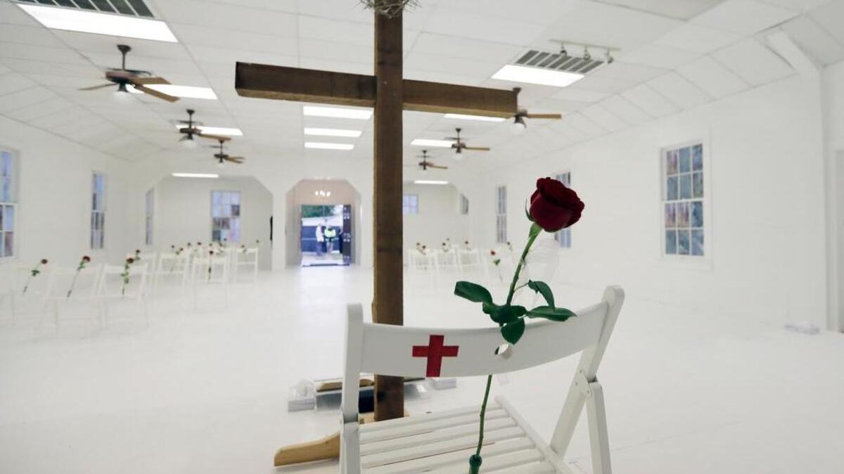 A memorial for the victims of the shooting at Sutherland Springs First Baptist Church includes 26 white chairs, each painted with a cross and and rose, is displayed in the church Sunday, Nov. 12, 2017, in Sutherland Springs, Texas. A man opened fire inside the church in the small South Texas community on Nov. 5, 2017, killing 26 and wounding 20 more.