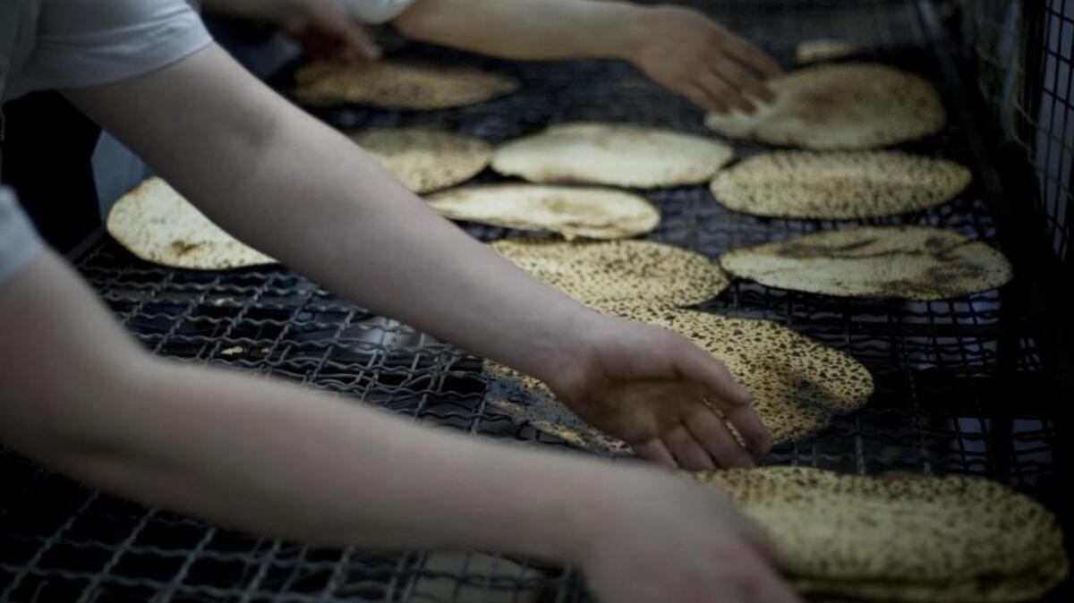 Ultra-Orthodox Jewish men prepare special Matza, a traditional handmade Passover unleavened bread. A Texas inmate has won a 12-year battle with the state over access to kosher meals in prison.