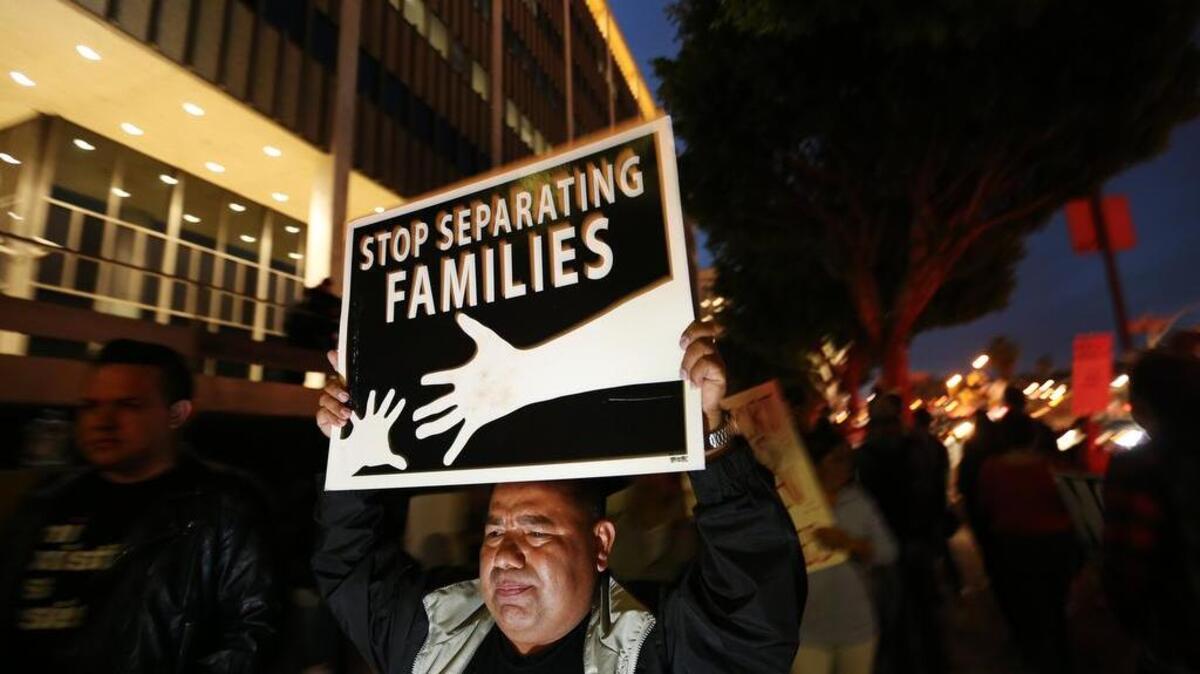 File: Dozens of people rally in downtown Los Angeles on February 9, 2017, to protest raids by Immigrations and Customs Enforcement officials in Southern California. (Luis Sinco/Los Angeles Times/TNS)