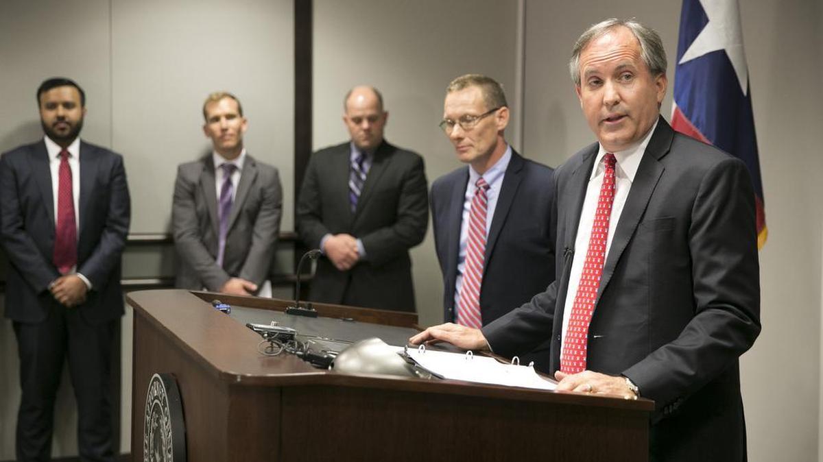 Texas Attorney General Ken Paxton, right, announces he is sueing to challenge President Obama's transgender bathroom order during a news conference at the Price Daniels Building in Austin in May. Also on hand are, left to right, Prerak Shah, senior counsel to the attorney general, AG attorneys Michael Toth and Austin Nimocks, and Harrold ISD Superintendent David Thweatt.