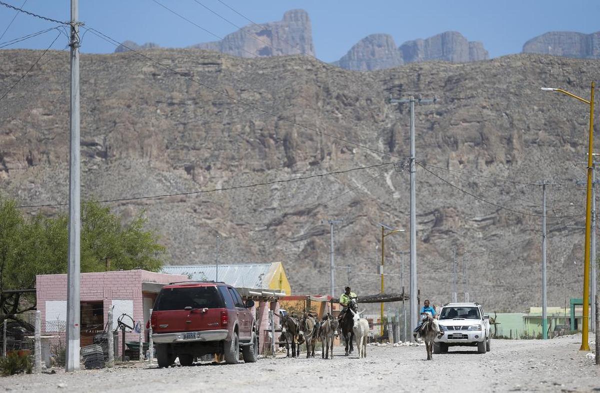 Horses and donkeys share the dirt streets with trucks and cars in Boquillas del Carmen, Mexico. The small village relies on income from visitors to Big Bend National Park in Texas, just across the river. .