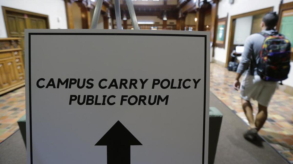 
Students arrive a public forum Sept. 30 at the University of Texas at Austin as a committee studies how to implement a law allowing students with concealed-handgun permits to carry firearms into class and other campus buildings. The law takes effect Aug. 1.
