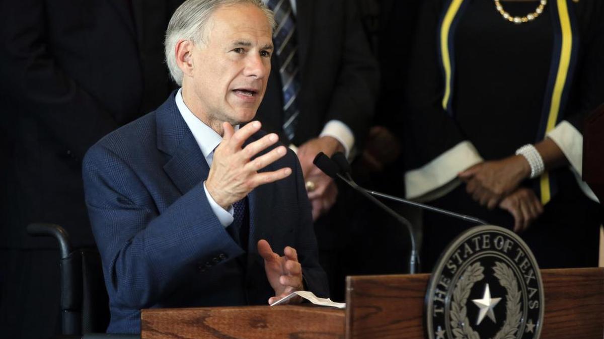 Texas Gov. Greg Abbott responds to questions about the police shootings during a news conference at City Hall in Dallas in this file photo.
