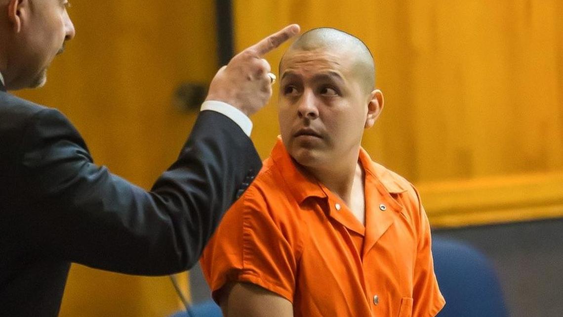 Border Patrol agent Joel Luna Rodriguez confers with his attorney Carlos A. Garcia after his arraignment in Brownsville by District Judge Benjamin Euresti on Feb. 3, 2016.