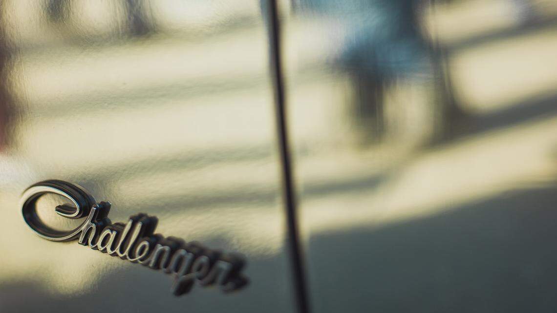 Closeup of a Dodge Challenger logo. Federal authorities said a Texas man ran a fake raffle that falsely promised to give away a Dodge Challenger SRT Demon (not the vehicle pictured).