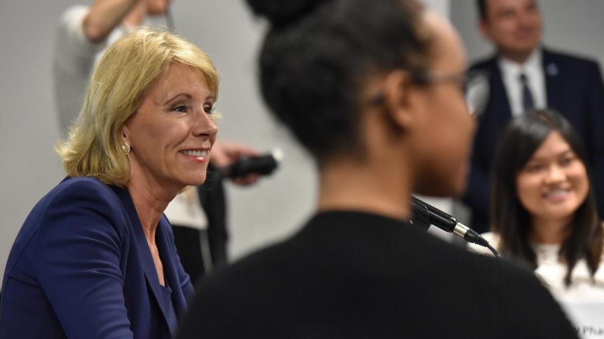 U.S. Secretary of Education Betsy DeVos, left, said recently that local school communities should decide whether to report students who lack immigration status to federal authorities.