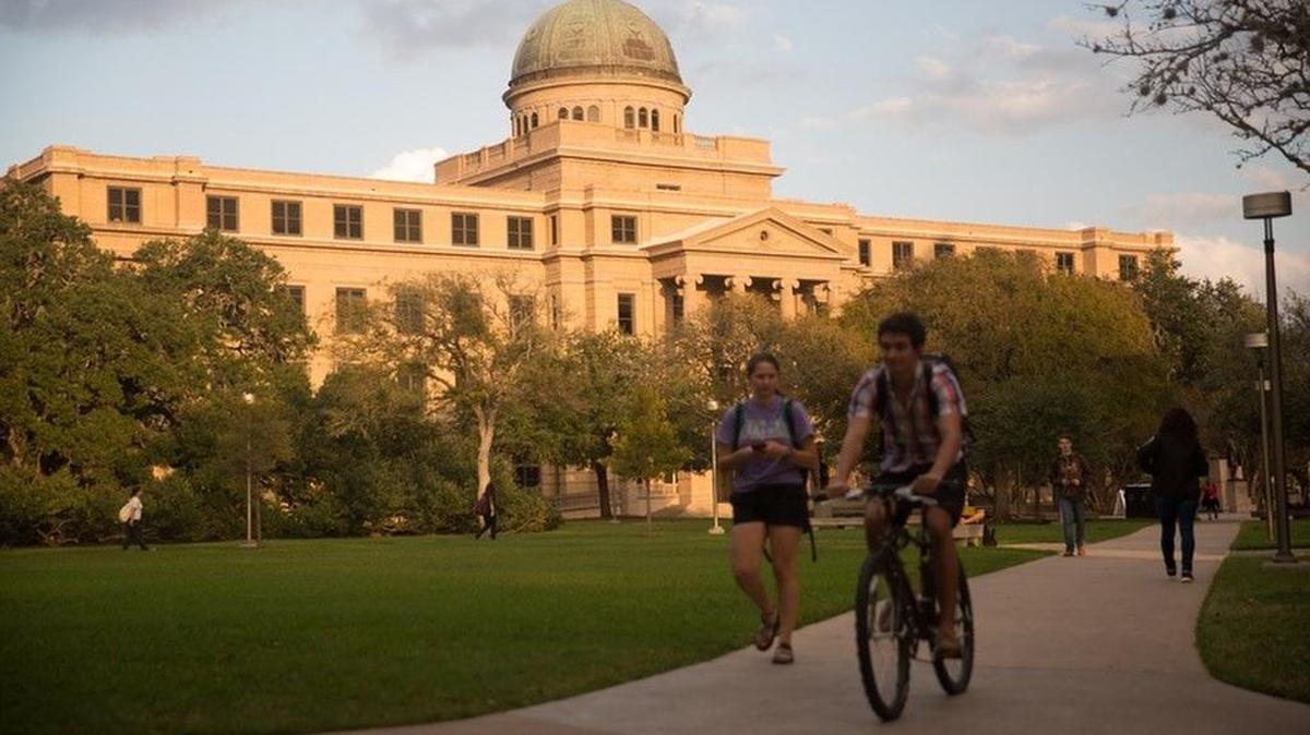 Students walk around the Texas A&M University campus in College Station.